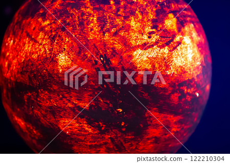 A mock-up of the planet Mars illuminated from the inside on a dark background. A mock-up of the planet Mars illuminated from the inside on a dark background. 122210304