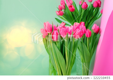 Bright spring festive background with pink tulips and a copy of the space. Bouquet of flowers. Bright spring festive background with pink tulips and a copy of the space. Bouquet of flowers. 122210455