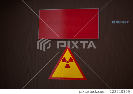 Radiation sign on the door in the oncology department of the hospital. 122210599