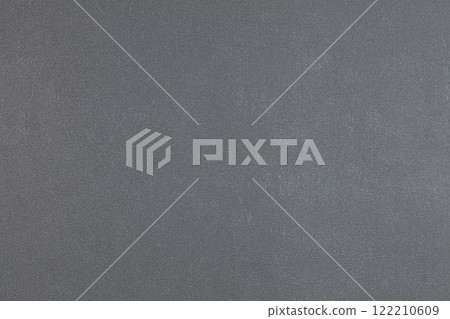 Background of gray evenly textured paper wallpaper. Gray plastered wall. 122210609