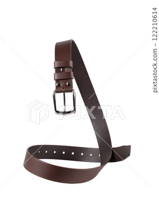 A brown leather belt with a metal buckle is beautifully curved and isolated on a white background. 122210614