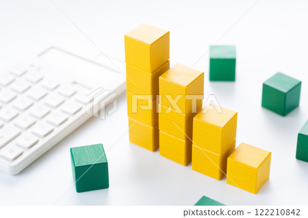Graph made of yellow building blocks and a calculator 122210842
