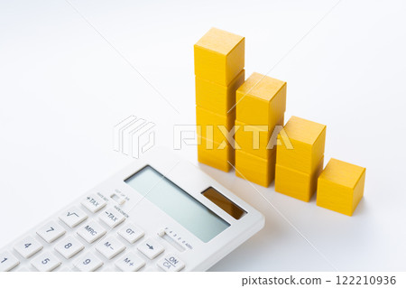 Graph made of yellow building blocks and a calculator 122210936