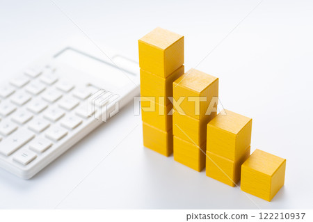 Graph made of yellow building blocks and a calculator Graph made of yellow building blocks and a calculator 122210937