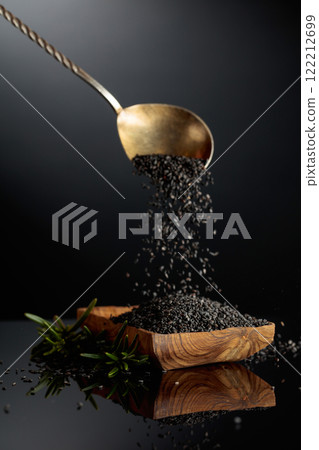 Black sesame on a black reflective background. Black sesame on a black reflective background. 122212699