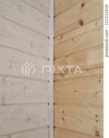 Contrast of untreated and treated wood planks showcasing natural grain patterns in a corner setting Contrast of untreated and treated wood planks showcasing natural grain patterns in a corner setting 122212818