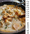 Delicious bowl of lohikeitto soup with bread croutons, close up view. Traditional Karelian and Finnish fish soup 122212832