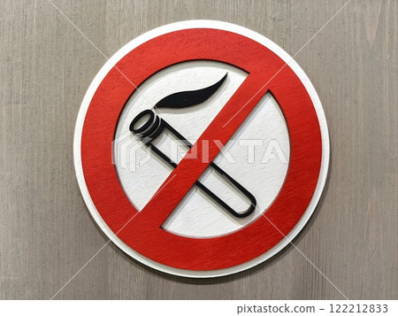 Close up of no smoking sign displayed on a wooden wall emphasizing the importance of a smoke-free environment 122212833