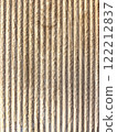 Close-up view of textured, striped surface showcasing natural wood grain in warm tones. Vertical background 122212837