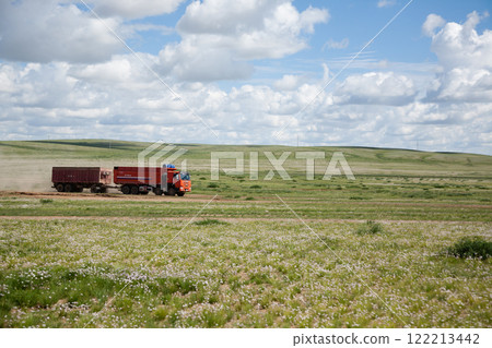 Red truck with mining cargo crosses the Gobi Desert, Mongolia Red truck with mining cargo crosses the Gobi Desert, Mongolia 122213442