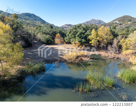 Aerial view of small lake in the in the valley of Dos Picos County Park in Ramona 122213807