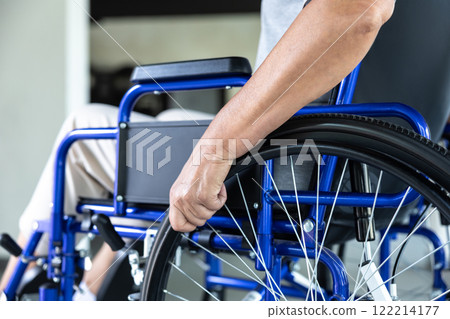 Woman in wheelchair in rehabilitation center Woman in wheelchair in rehabilitation center 122214177
