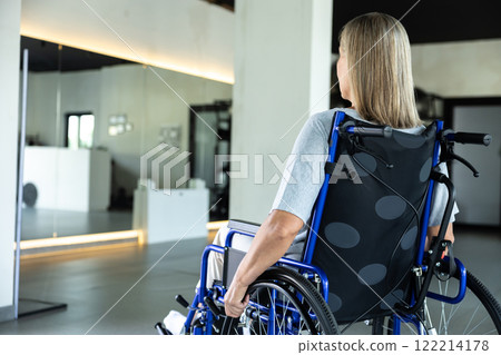 Woman in wheelchair in rehabilitation center Woman in wheelchair in rehabilitation center 122214178