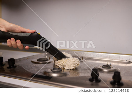 Performing a Deep Cleaning of Kitchen Equipment Using a Steam Cleaner for Hygiene and Safety 122214418