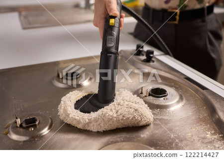 Performing a Deep Cleaning of Kitchen Equipment Using a Steam Cleaner for Hygiene and Safety Performing a Deep Cleaning of Kitchen Equipment Using a Steam Cleaner for Hygiene and Safety 122214427