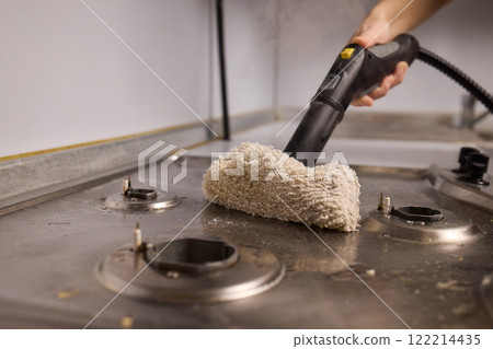 Performing a Deep Cleaning of Kitchen Equipment Using a Steam Cleaner for Hygiene and Safety Performing a Deep Cleaning of Kitchen Equipment Using a Steam Cleaner for Hygiene and Safety 122214435