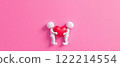 Two 3D figurines holding a red heart are suitable for a project on the theme of Valentine's Day, Love and Relationships, Hug and Friendship Day 122214554