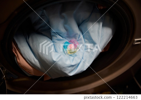Using Laundry Detergent Pods While Doing Laundry in the Washing Machine with Clothes Using Laundry Detergent Pods While Doing Laundry in the Washing Machine with Clothes 122214663