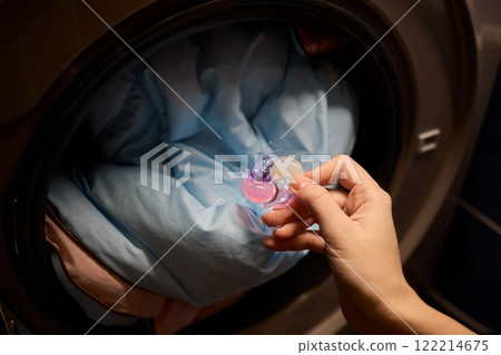 Using Laundry Detergent Pods While Doing Laundry in the Washing Machine with Clothes Using Laundry Detergent Pods While Doing Laundry in the Washing Machine with Clothes 122214675