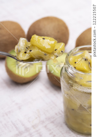 Kiwi jam lifted up with a spoon Kiwi confiture lifted up with a spoon 122215507