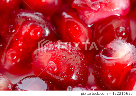 Juicy Pomegranate Seeds with Water Droplets macro shot clous up  122215653