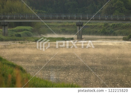 Spring rural morning scenery: River mist flows through the river early in the morning Spring rural morning scenery: River mist flows through the river early in the morning 122215820