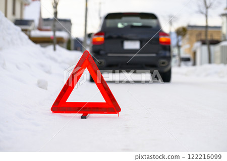 Broken down car and stop triangle 122216099