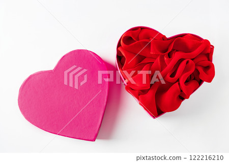 Heart shaped open gift box on white background. Heart shaped open gift box on white background. 122216210