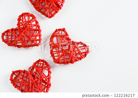Red handmade hearts made of twigs on a white background Red handmade hearts made of twigs on a white background 122216217