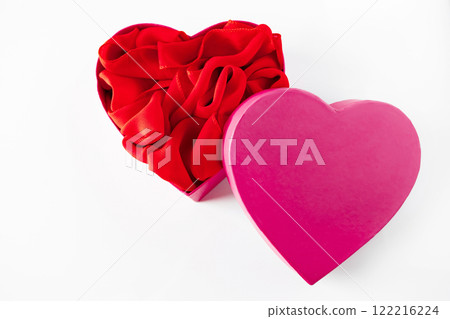 Heart shaped open gift box on white background. 122216224