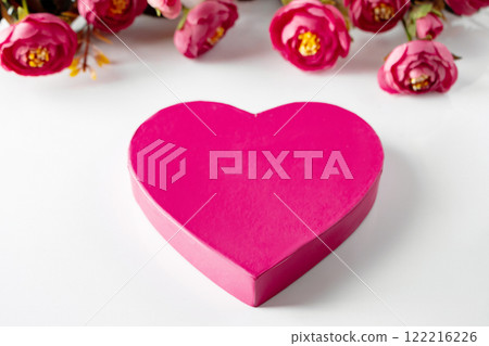 Pink heart for valentines day on a background of flowers. Pink heart for valentines day on a background of flowers. 122216226