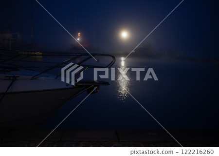 Boat on the water. Night shooting. Moon reflected in the water 122216260