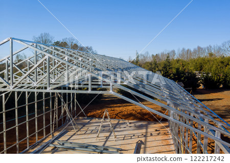 Metallic structure is taking shape as construction progresses in metal framed warehouse Metallic structure is taking shape as construction progresses in metal framed warehouse 122217242