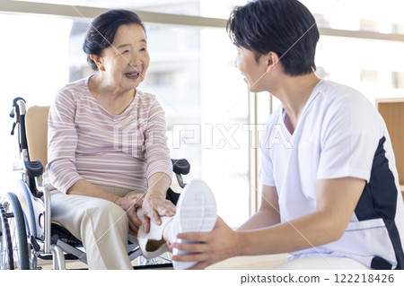Medical: Senior woman receiving a medical examination from a physical therapist Medical: Senior woman receiving a medical examination from a physical therapist 122218426