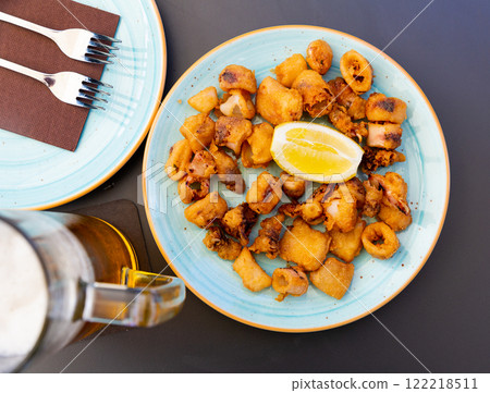 Spanish seafood dish battered fried baby squid Spanish seafood dish battered fried baby squid 122218511