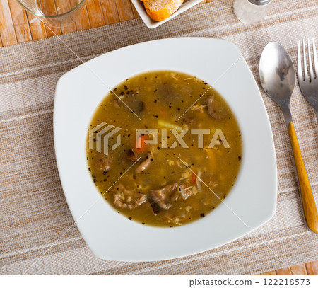 Mushroom nutritious soup with pork and other ingredients closeup 122218573