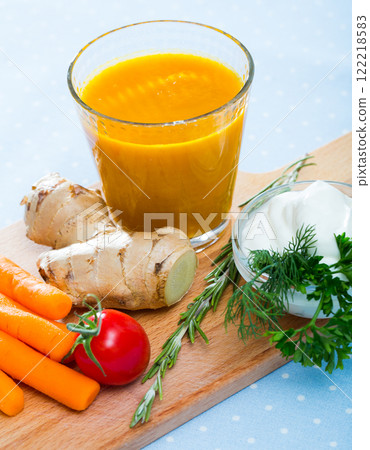 Fresh carrot and ginger juice Fresh carrot and ginger juice 122218583
