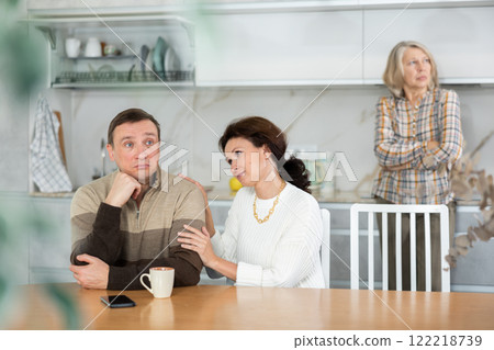 Family quarrel, adult woman calming man 122218739