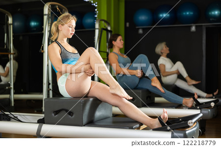 woman doing exercises for hip mobility and back 122218779