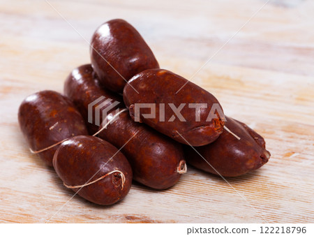 Blood sausages on wooden table 122218796