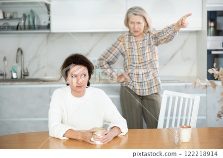 Irritated elderly woman having quarrel with her daughter 122218914