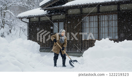 Old man removing snow 122219323