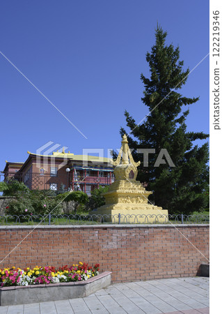 Buddhist stupa on the background of the main building of the monastery datsan Rinpoche Bagsha Buddhist stupa on the background of the main building of the monastery datsan Rinpoche Bagsha 122219346