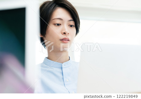 Young women listening to a conversation in the office Young women listening to a conversation in the office 122219849