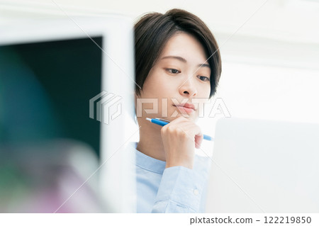 Young women listening to a conversation in the office Young women listening to a conversation in the office 122219850