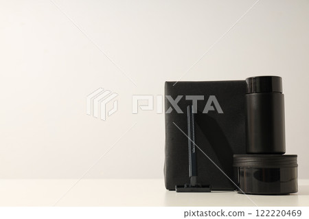Bottle and jar with men's cosmetics, razor and black box on white background, space for text 122220469