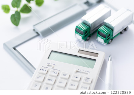 Binder and white calculator and truck 122220889