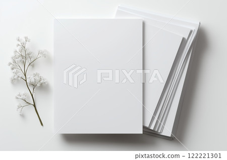 Blank pages and dried flowers create a calming aesthetic for creativity and journaling 122221301