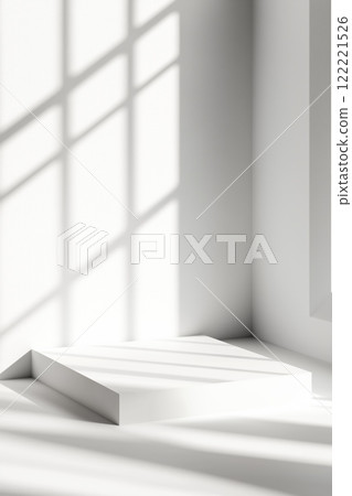 Bright sunlight casting shadows in a minimalist interior corner during the afternoon 122221526