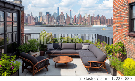 Rooftop patio with cozy furniture overlooking city skyline and river on sunny day 122221820